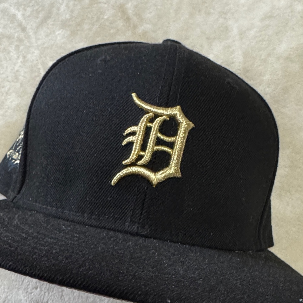New Era Black Hat with Gold Embroidered 'D' Logo